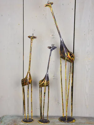 Three vintage giraffe sculptures